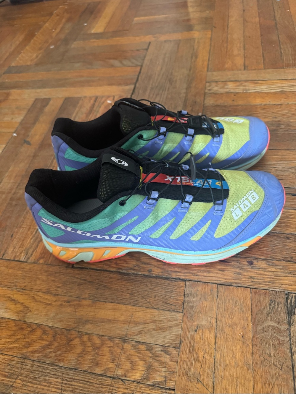 Salomon trail shoes in blue, green, purple and orange